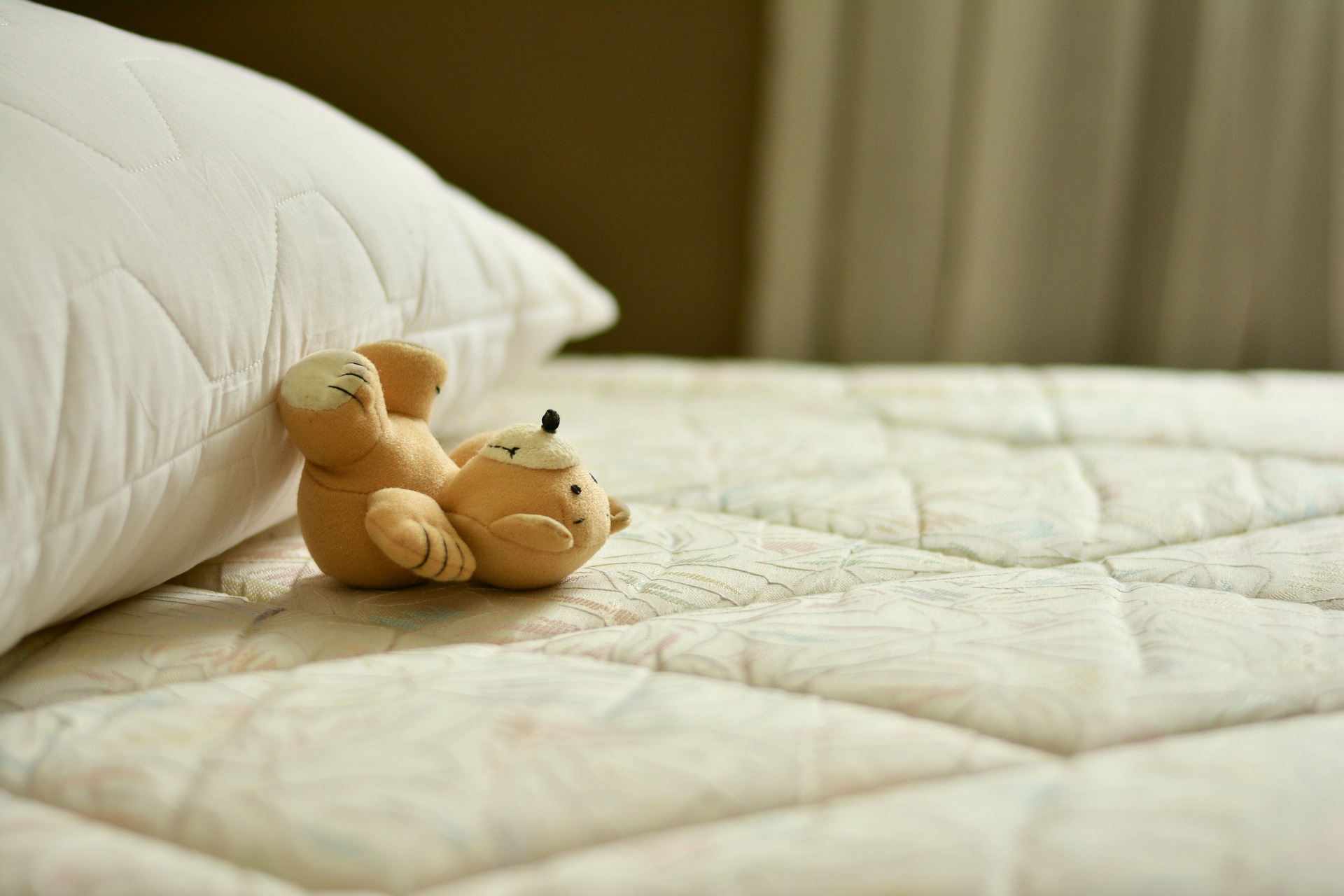 teddy bear on a bed